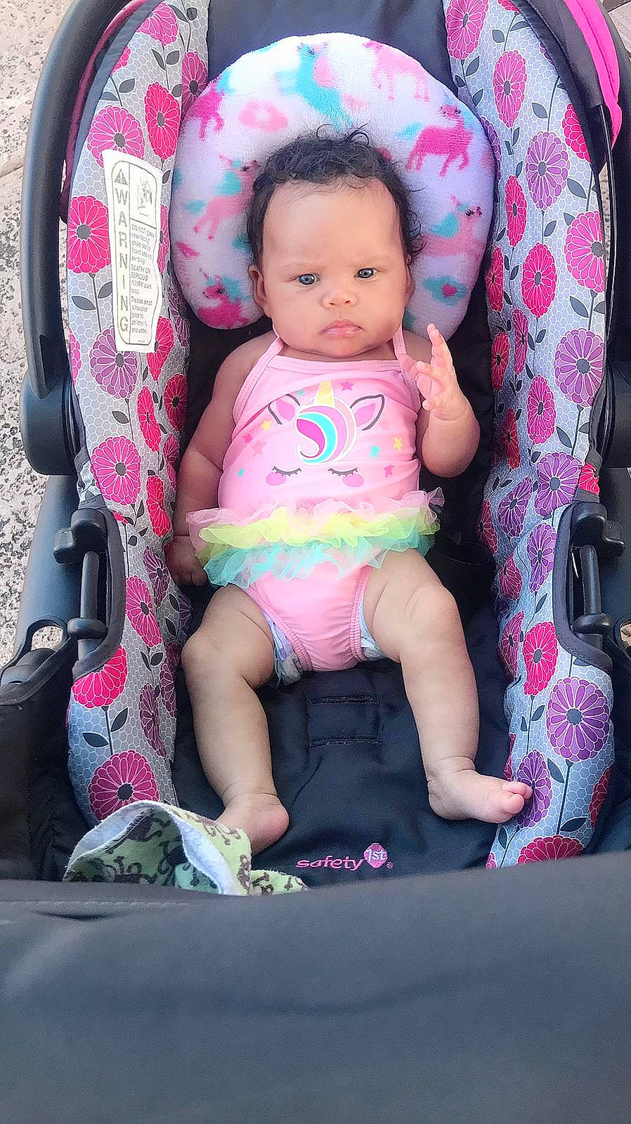 Kiana joined the competition — help win amazing prizes! baby, baby_carriage, baby_products, baby_safety, baby_toddler_clothing, cheek, child, comfort, human_body, lap, magenta, mammal, peach, person, pink, product, shoe, sitting, skin, sock
