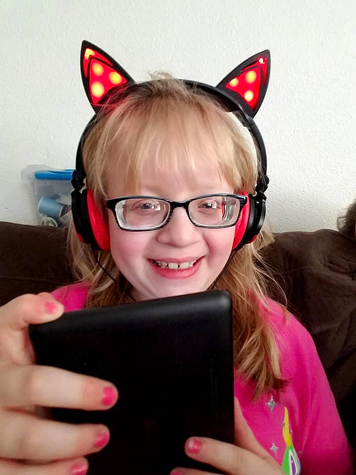 Payten joined the competition — help win amazing prizes! audio_equipment, ear, electronic_device, eyewear, fashion_accessory, fun, gadget, gesture, glasses, head, human_body, joy, organ, person, pink, smile, technology, vision_care, whiskers