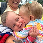 Walker joined the competition — help win amazing prizes! toddler, baby, kiss, hug, smile, woman, outdoor, happy, child, colorful_clothing, towel, drink, hand, face, affection, family, love, joy, person, portrait