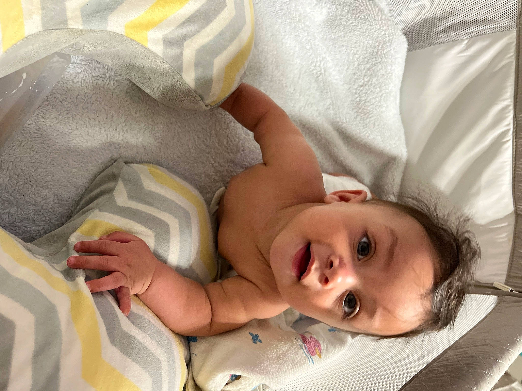 Kyng is registered to the contest to win money with this photo: baby, baby_products, baby_sleeping, baby_toddler_clothing, bedtime, cheek, child, comfort, eye, eyelash, hand, happy, head, linens, mouth, nose, person, skin, smile, surprise