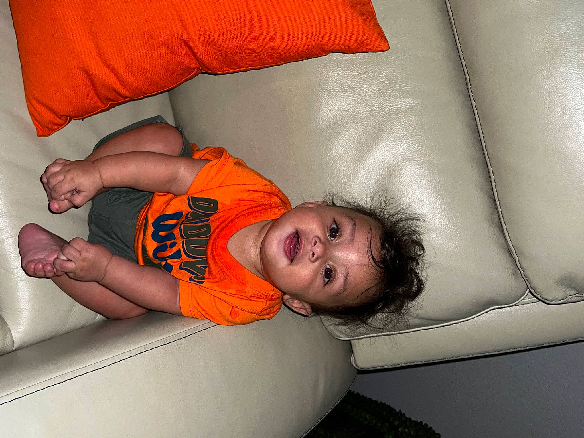 Kyng joined the competition — help win amazing prizes! baby, bed, car_seat, child, comfort, couch, elbow, finger, fun, human_body, human_leg, leg, linens, orange, person, room, sitting, t_shirt, toddler, vehicle_door
