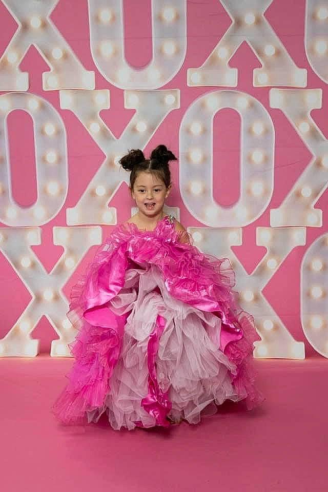 Rayne joined the competition — help win amazing prizes! choreography, costume_design, dress, entertainment, event, eyelash, face, fashion_design, formal_wear, gown, happy, haute_couture, magenta, performing_arts, person, petal, pink, purple, ruffle, smile