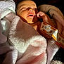 baby, newborn, blanket, sleeping, infant, soft, cozy, hand, face, skin, wrapped, cute, warm_light, resting, indoors, comfort, peaceful, young_child, portrait, fabric