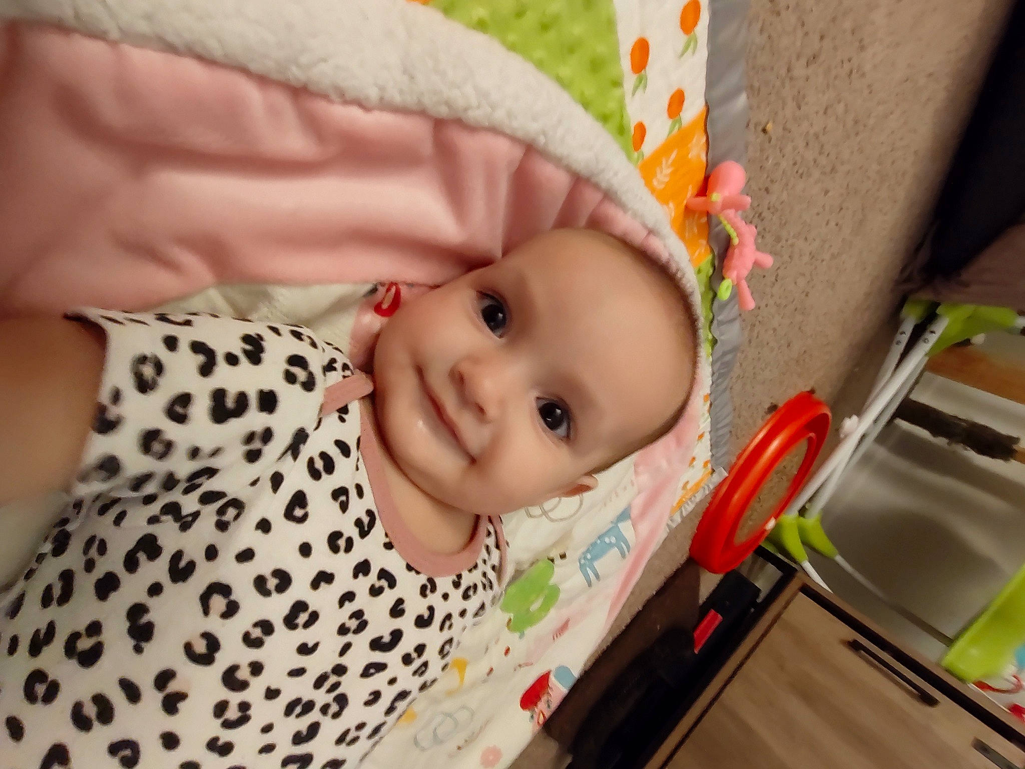 Allison is registered to the contest to win money with this photo: baby, baby_products, baby_safety, baby_toddler_clothing, cheek, child, eye, fun, happy, joy, linens, nose, pattern, person, pink, room, skin, sleeve, smile, textile