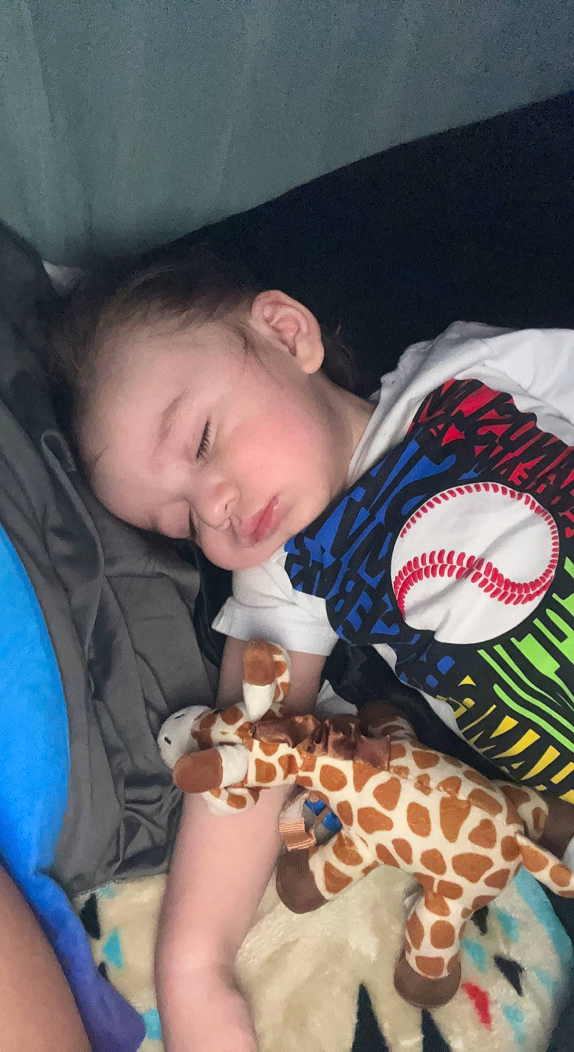 Makaio is registered to the contest to win money with this photo: arm, baby, baby_products, baby_sleeping, baby_toddler_clothing, blue, child, comfort, cool, face, fun, linens, mammal, mouth, organ, pattern, person, sleeve, textile, toddler