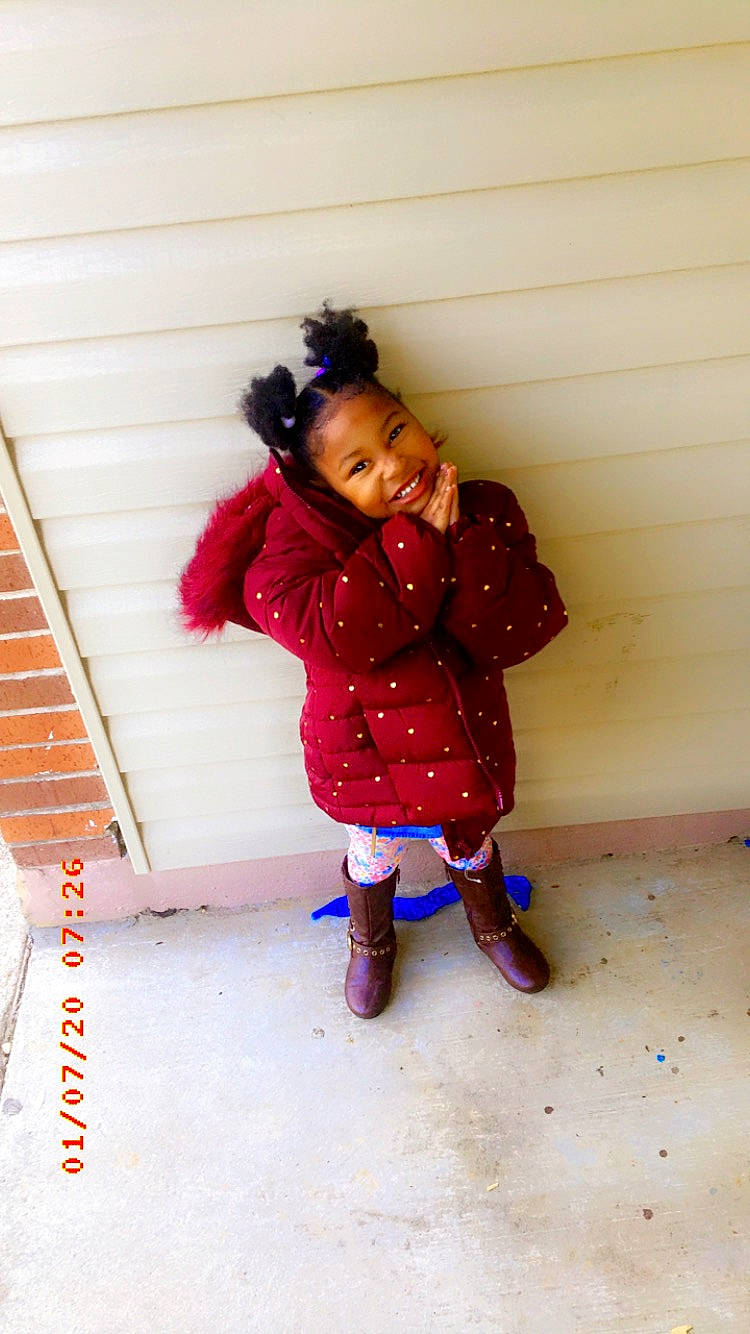 Ma'Kenly Todd is registered to the contest to win money with this photo: cheek, child, fun, happy, jacket, joy, magenta, outerwear, person, pink, play, purple, shoe, skin, smile, standing, toddler