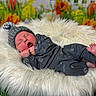 Waylon Cash is registered to the contest to win money with this photo: baby, blanket, bodypart, clothing, coat, face, finger, flower, glove, hand, hat, head, jacket, newborn, person, photography, plant, portrait, sleeping, yawning