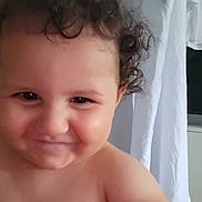 Aylan a rejoint le concours — aidez-le/la à gagner de superbes lots ! toddler, child, curly_hair, smile, face, bare_shoulders, indoor, curtain, cheeky, laugh, closeup, portrait, baby, skin, caucasian, person, expression, playful, young_child, human