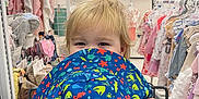 Mason joined the competition — help win amazing prizes! baby_clothes, blonde_hair, blue, child, clothing_store, crab, cute, hat, holding, indoor, octopus, pattern, person, playful, rack, retail, shopping_cart, starfish, toddler, toy