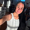 girl, braids, selfie, white_tank_top, smile, indoor, sunlight, shadow, furniture, dresser, people, casual, relaxing, room, young_person, portrait, happy, home, candid, friends