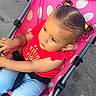 Raighlynn is registered to the contest to win money with this photo: toddler, child, stroller, pink, polka_dot, red_shirt, jeans, outdoor, sidewalk, hair, cute, baby, seatbelt, curious, person, casual, daylight, urban, young_child, portrait