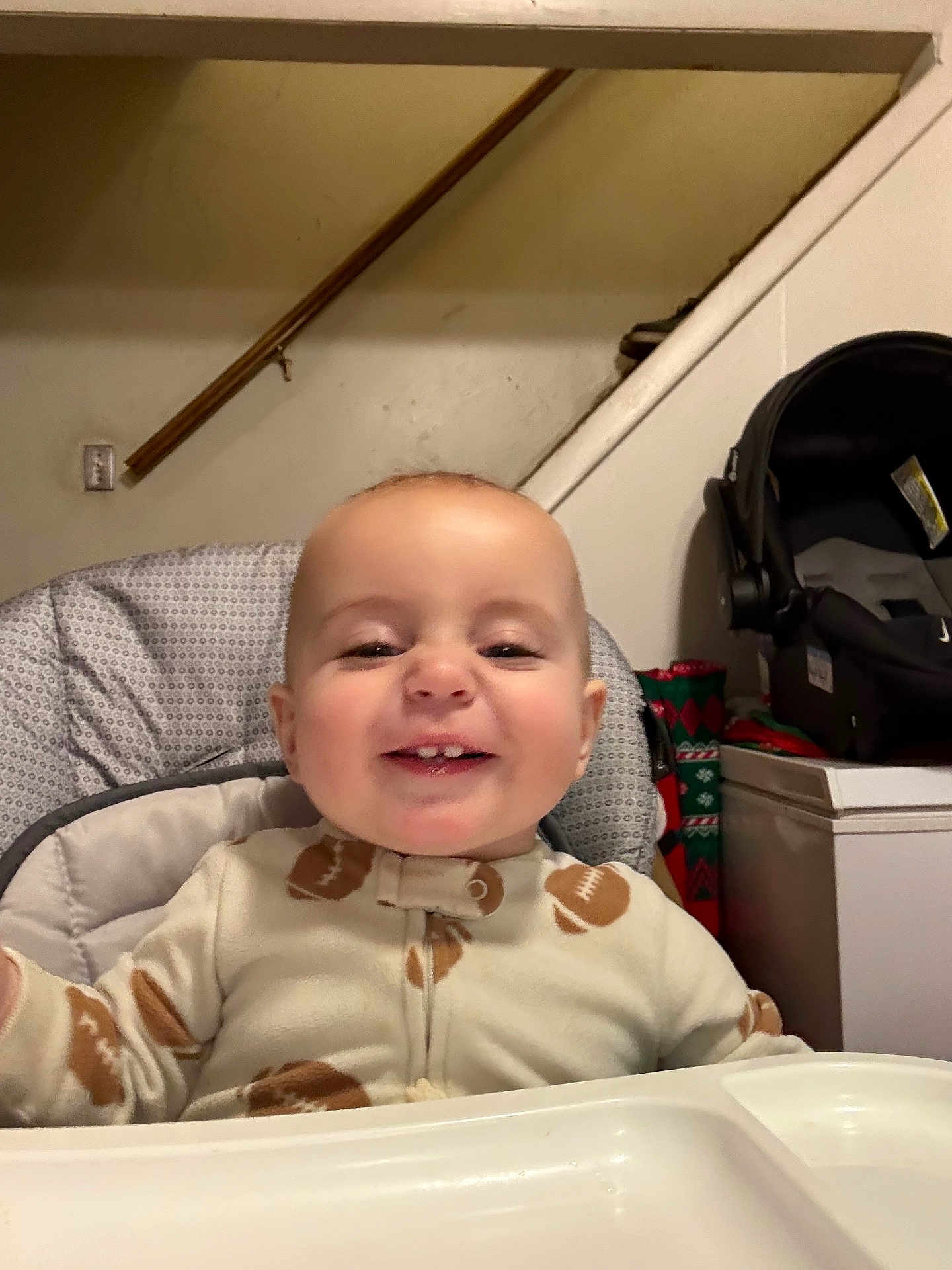 Michael joined the competition — help win amazing prizes! baby, child, smile, high_chair, onesie, indoor, face, happy, infant, person, furniture, staircase, car_seat, baby_gear, table, clothing, cute, portrait, young_child, home