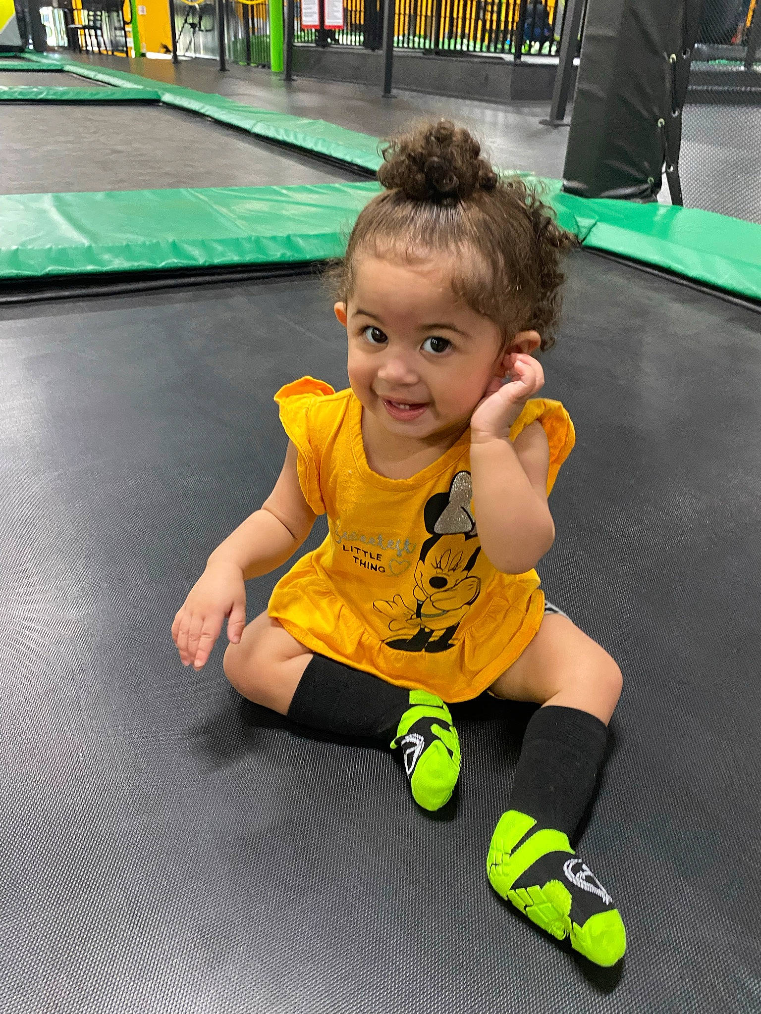 Aubriella is registered to the contest to win money with this photo: baby, child, competition_event, floor, flooring, fun, green, indoor_games_and_sports, joint, joy, knee, leisure, person, player, recreation, shorts, smile, sports, sportswear, t_shirt