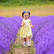 Aaliyah-May is registered to the contest to win money with this photo: child, clothing, dress, face, female, field, flower, girl, grass, head, herbal, herbs, lavender, outdoors, person, petal, photography, plant, portrait, purple