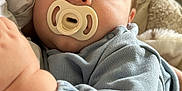 Cooper is registered to the contest to win money with this photo: baby, child, closeup, clothing, comfort, cozy, cushion, face, hand, indoor, infant, nap, pacifier, peaceful, person, portrait, rest, sleeping, soft_fabric, young
