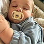 Cooper is registered to the contest to win money with this photo: baby, child, closeup, clothing, comfort, cozy, cushion, face, hand, indoor, infant, nap, pacifier, peaceful, person, portrait, rest, sleeping, soft_fabric, young
