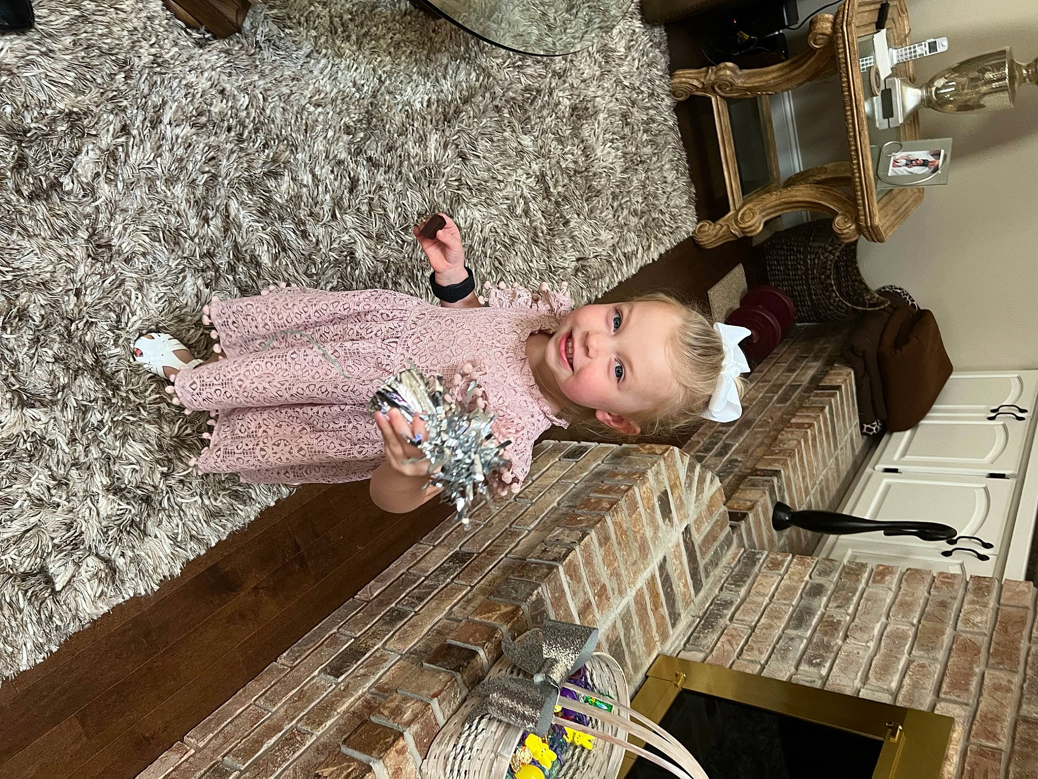 Kenslee is registered to the contest to win money with this photo: baby, child, comfort, dress, flooring, fun, hardwood, human_leg, joy, machine, metal, pattern, person, room, sitting, toddler, wood