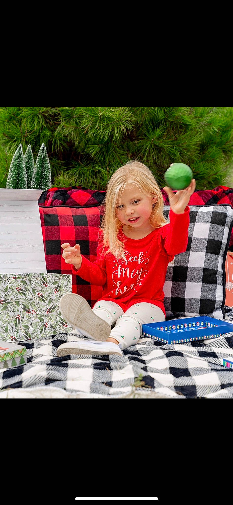 Kenslee joined the competition — help win amazing prizes! couch, event, fun, grass, happy, holiday, leaf, leisure, linens, pattern, person, plaid, recreation, smile, spring, table, tablecloth, tartan, textile, toddler