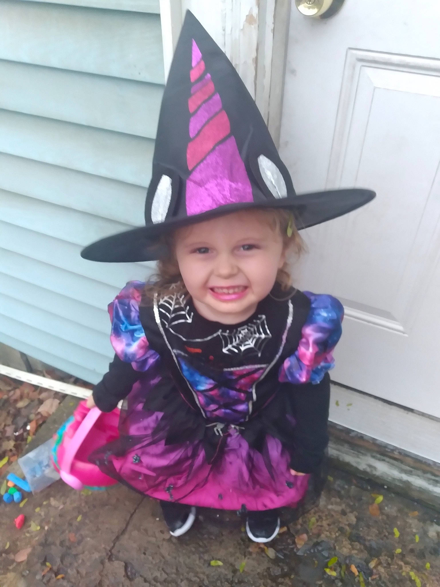 Lucille joined the competition — help win amazing prizes! baby_toddler_clothing, cone, costume, costume_hat, door, event, fashion_accessory, fun, hat, headgear, headwear, joy, magenta, party_hat, party_supply, person, pink, purple, smile, sun_hat