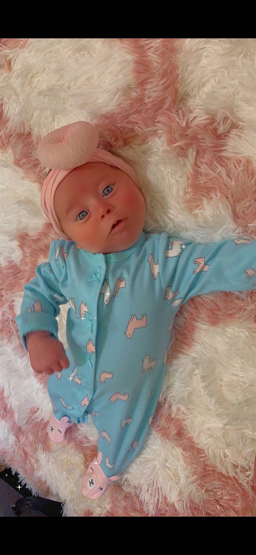 Elona is registered to the contest to win money with this photo: art, baby, baby_products, baby_toddler_clothing, baby_toys, cheek, child, doll, eye, headwear, iris, linens, pattern, peach, person, pink, skin, sleeve, textile, toddler