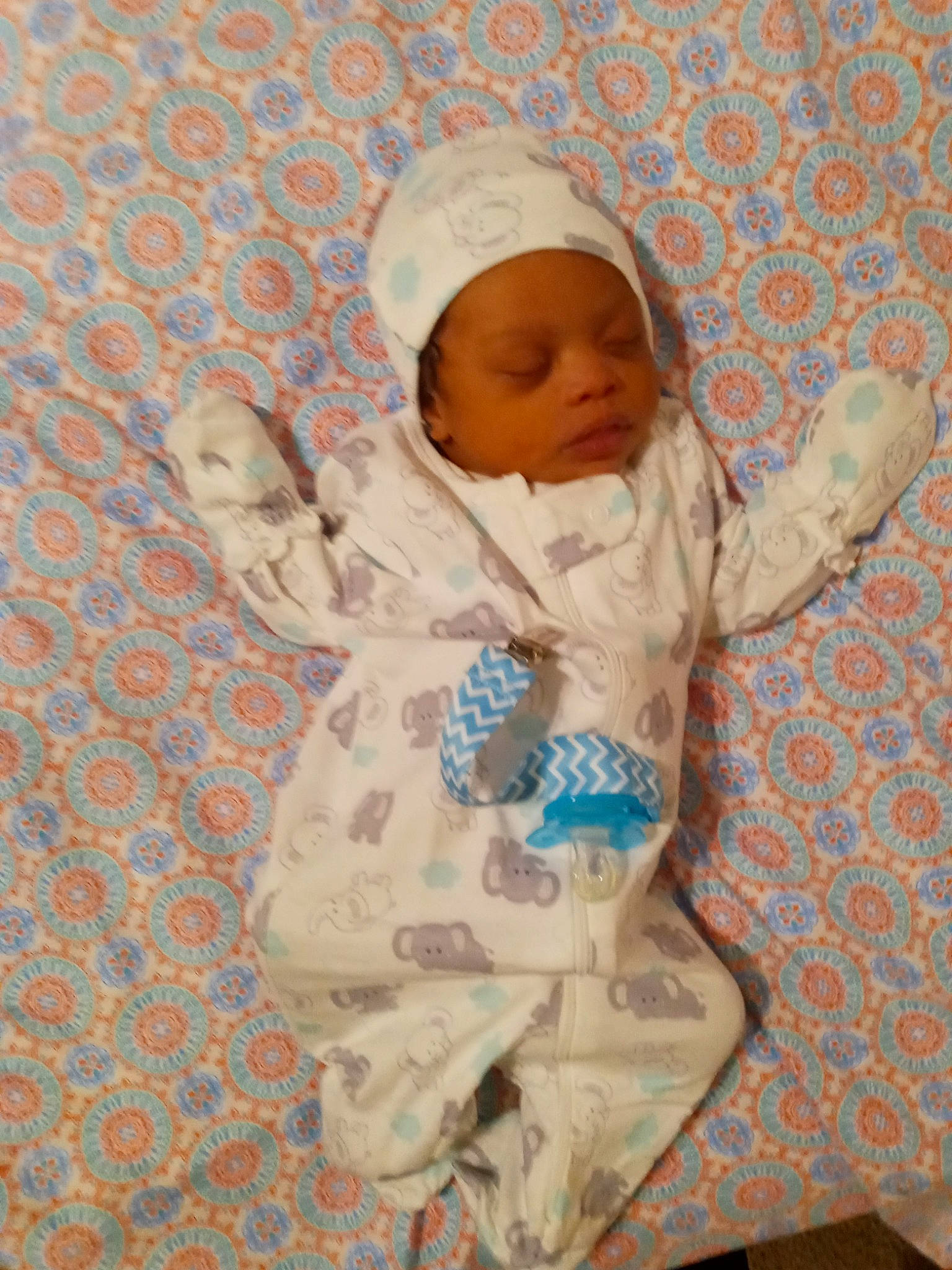 Azai is registered to the contest to win money with this photo: baby, baby_products, baby_sleeping, baby_toddler_clothing, cap, child, comfort, face, happy, hat, headwear, linens, outerwear, pattern, person, room, sleeve, textile, toddler