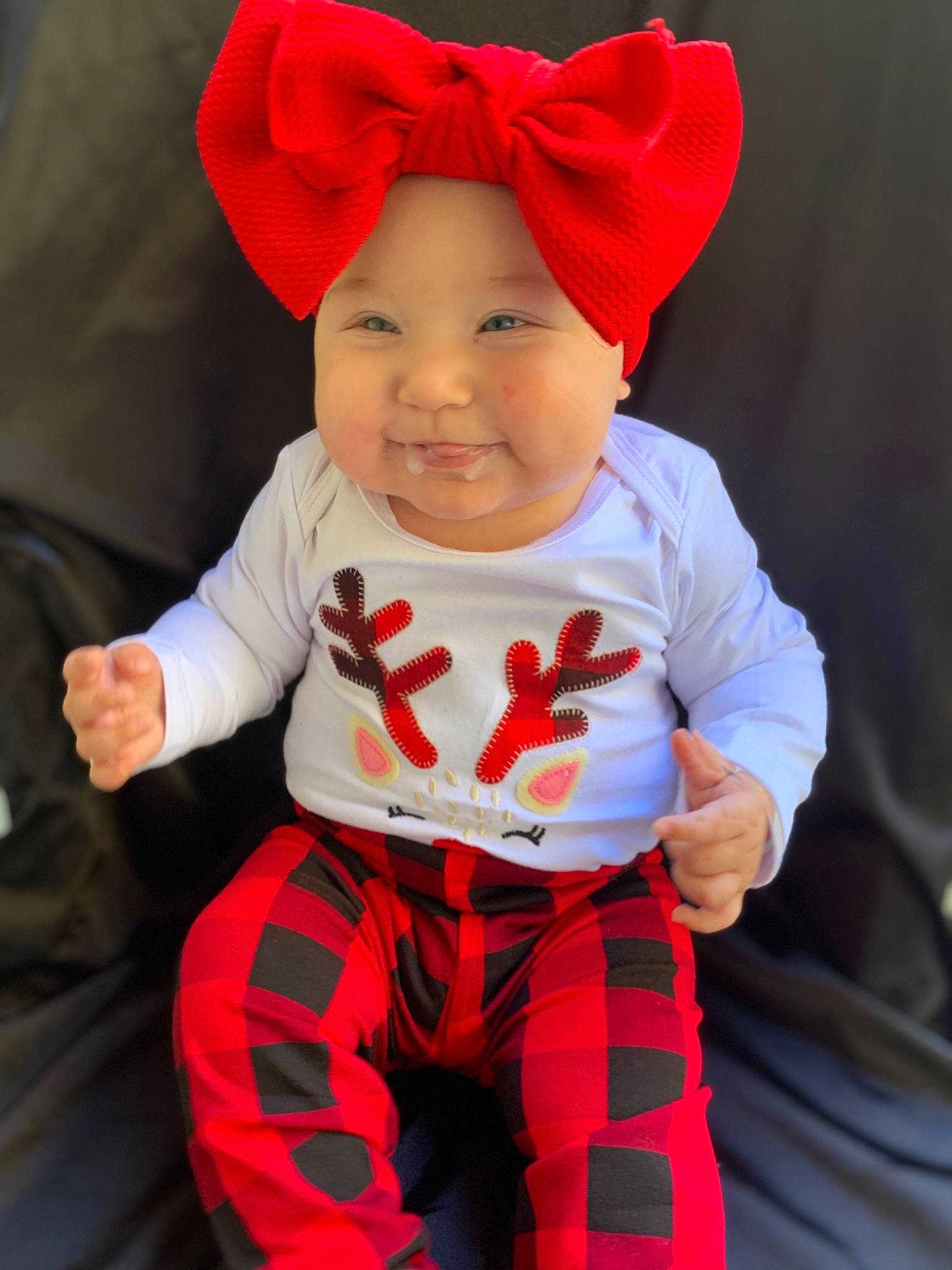 Hazel Mae is registered to the contest to win money with this photo: baby, baby_laughing, baby_products, baby_toddler_clothing, bonnet, carmine, cheek, child, cool, costume_accessory, costume_hat, facial_expression, headgear, headwear, lip, pajamas, pattern, person, product, red