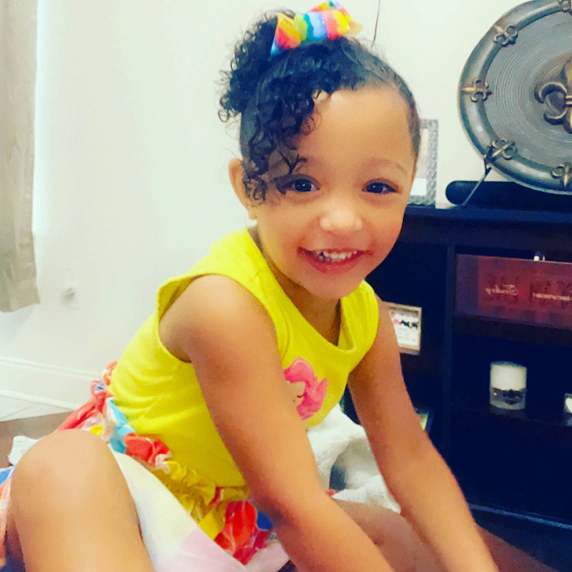 Jaylah is registered to the contest to win money with this photo: baby_toddler_clothing, chest, child, cool, electric_blue, eye, fun, hairstyle, happy, human_leg, joy, knee, person, recreation, skin, smile, sportswear, standing, t_shirt, thigh