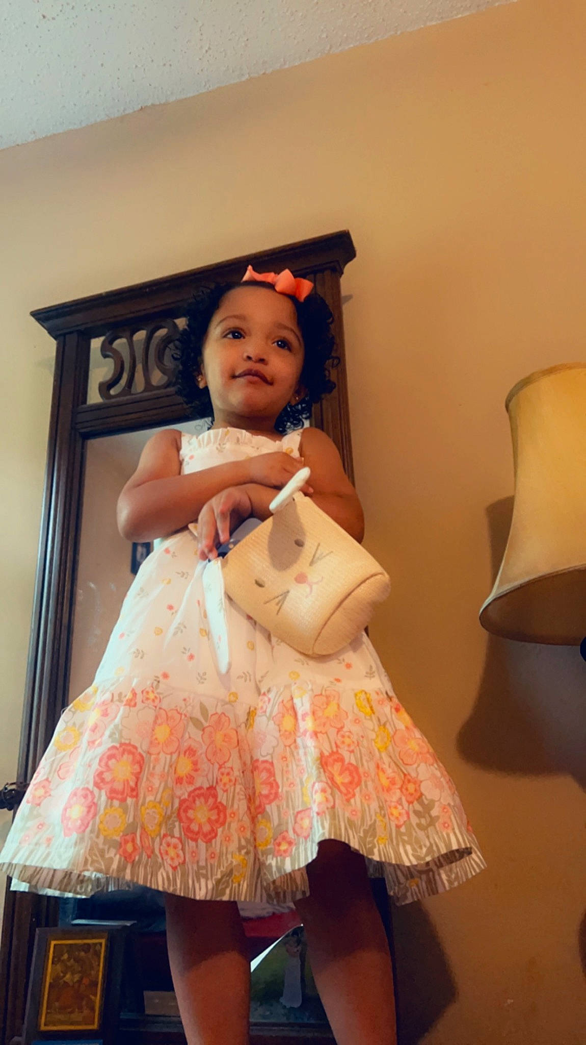 Jaylah is registered to the contest to win money with this photo: baby_toddler_clothing, child, cocktail_dress, costume, day_dress, fashion_design, fun, happy, human_leg, magenta, one_piece_garment, pattern, peach, person, pink, room, ruffle, sitting, thigh, toddler