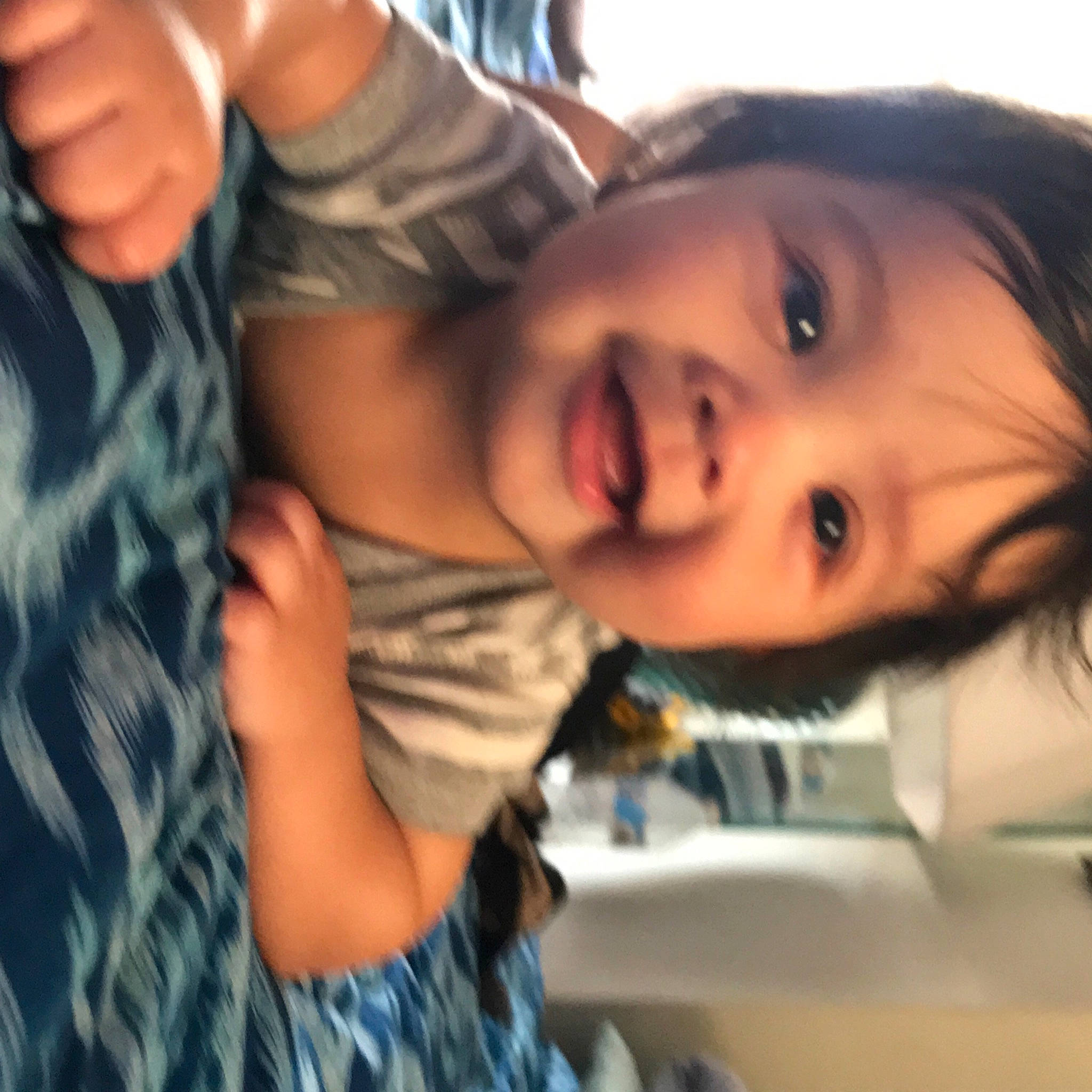 Kohen Valentin Gounder is registered to the contest to win money with this photo: black_hair, cheek, chin, eyebrow, eyelash, finger, forehead, gesture, grass, happy, iris, jaw, lip, mouth, nose, person, plant, skin, smile, toddler