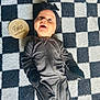 Layla is registered to the contest to win money with this photo: baby, infant, smiling, blanket, checkered_pattern, headband, onesie, wooden_sign, two_months, milestone, happy, lying_down, face, child, cute, indoor, portrait, clothing, baby_milestone, newborn