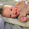 baby, infant, blanket, lying_down, medical_tube, medical_tape, blue_eyes, skin, newborn, cute, soft_texture, hospital, healthcare, person, child, indoors, closeup, expression, small_hands, resting