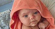 Raya joined the competition — help win amazing prizes! baby, blanket, blue_eyes, child, closeup, cuddle, curious, cute, expression, face, hand, hooded_towel, indoor, infant, newborn, nursery, person, soft_skin, towel, wrapped