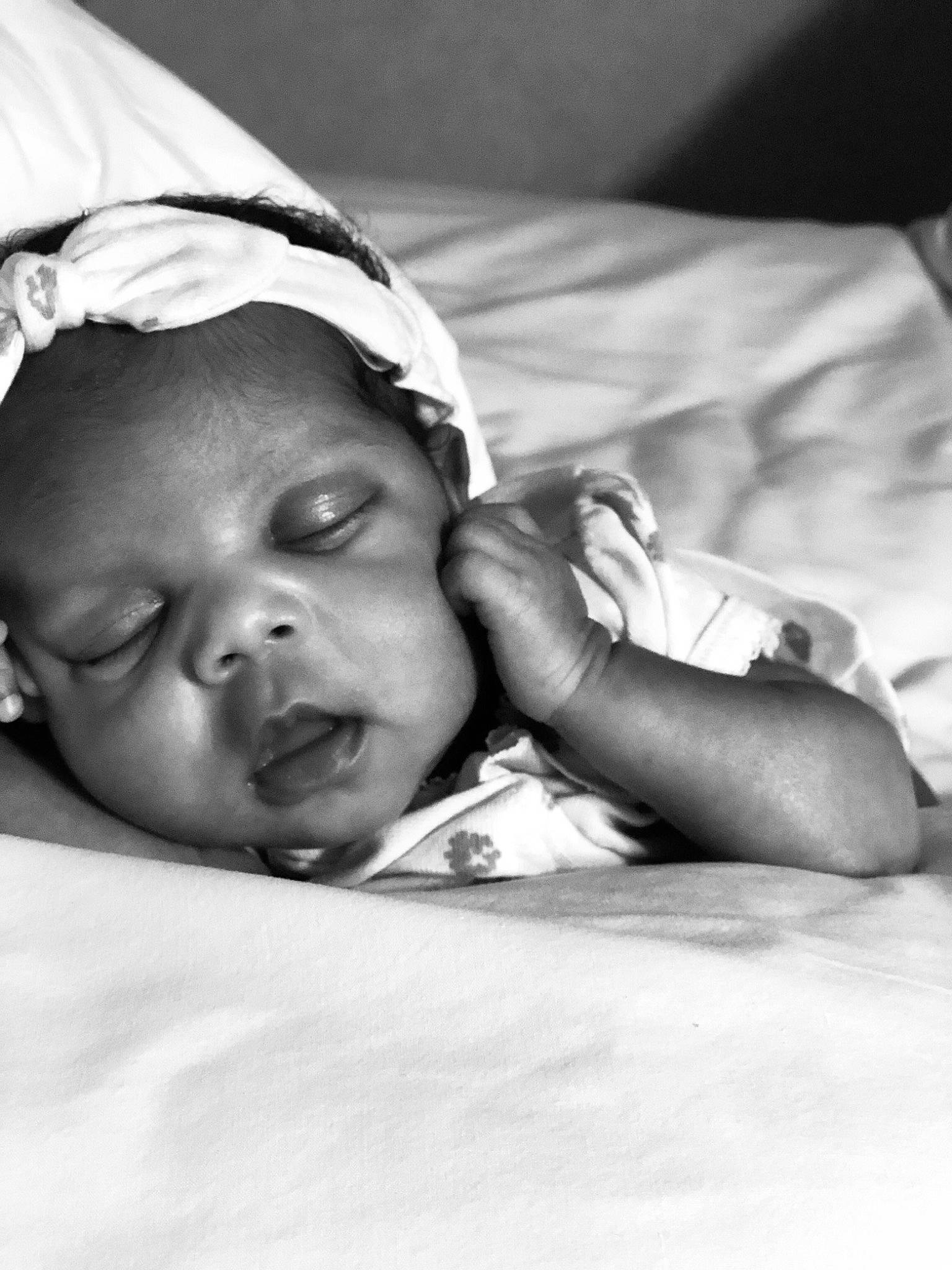 Avani is registered to the contest to win money with this photo: baby, black_and_white, cheek, comfort, eyebrow, finger, flash_photography, gesture, hair, happy, human, human_body, iris, lip, mammal, mouth, nose, person, skin, smile