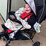 Jeremiah Cox is registered to the contest to win money with this photo: toddler, stroller, blanket, child, happy, smile, outdoor, sidewalk, clothing, footwear, canopy, baby, person, seat, wheel, jacket, playful, cute, expression, urban