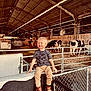 Liam joined the competition — help win amazing prizes! animal, boy, cattle, child, clothing, cow, face, footwear, head, jeans, livestock, male, nature, outdoors, pants, person, photography, portrait, shoe, sitting
