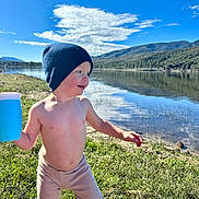 Liam joined the competition — help win amazing prizes! beanie, boy, cap, child, clothing, face, grass, hat, head, lake, male, nature, outdoors, person, photography, plant, portrait, summer, tree, water