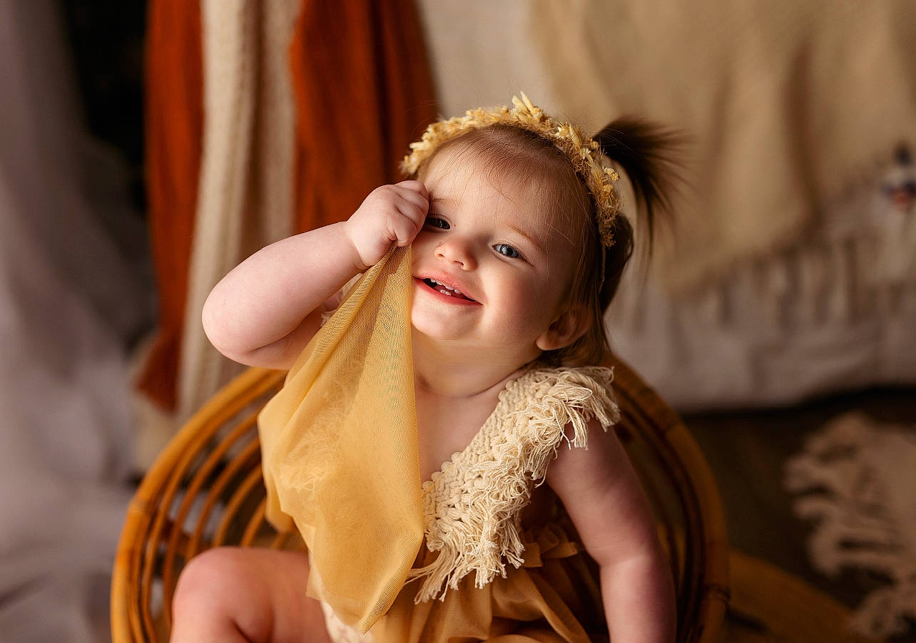 River is registered to the contest to win money with this photo: blond, brown_hair, child, curtain, dress, event, eye, facial_expression, fashion_accessory, fashion_design, flash_photography, fun, happy, headpiece, iris, jewellery, joy, long_hair, person, skin