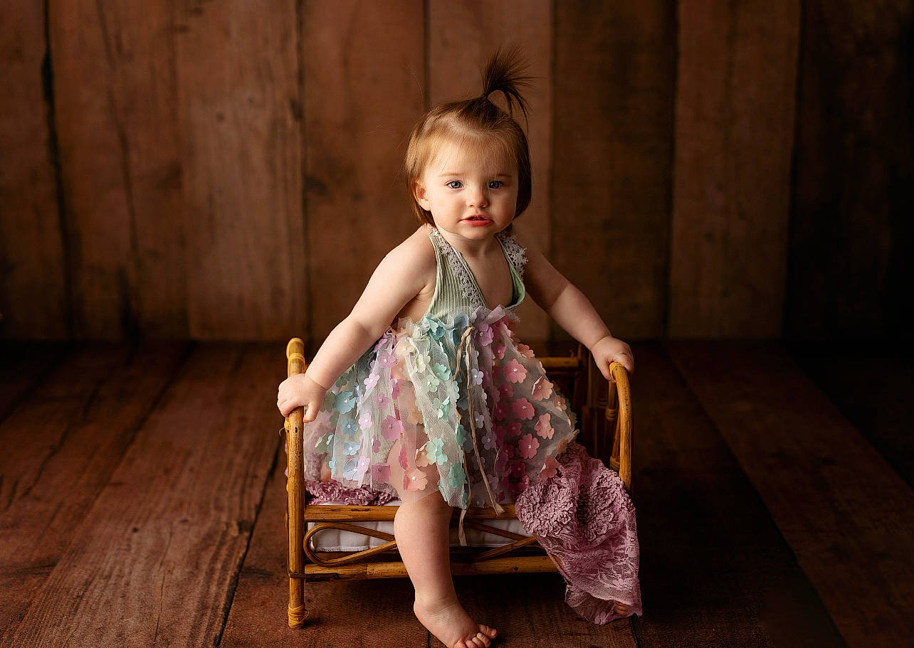 River joined the competition — help win amazing prizes! baby_toddler_clothing, child, day_dress, door, dress, event, fashion_design, flash_photography, flooring, foot, fun, happy, hardwood, leisure, magenta, one_piece_garment, person, sandal, sitting, toddler