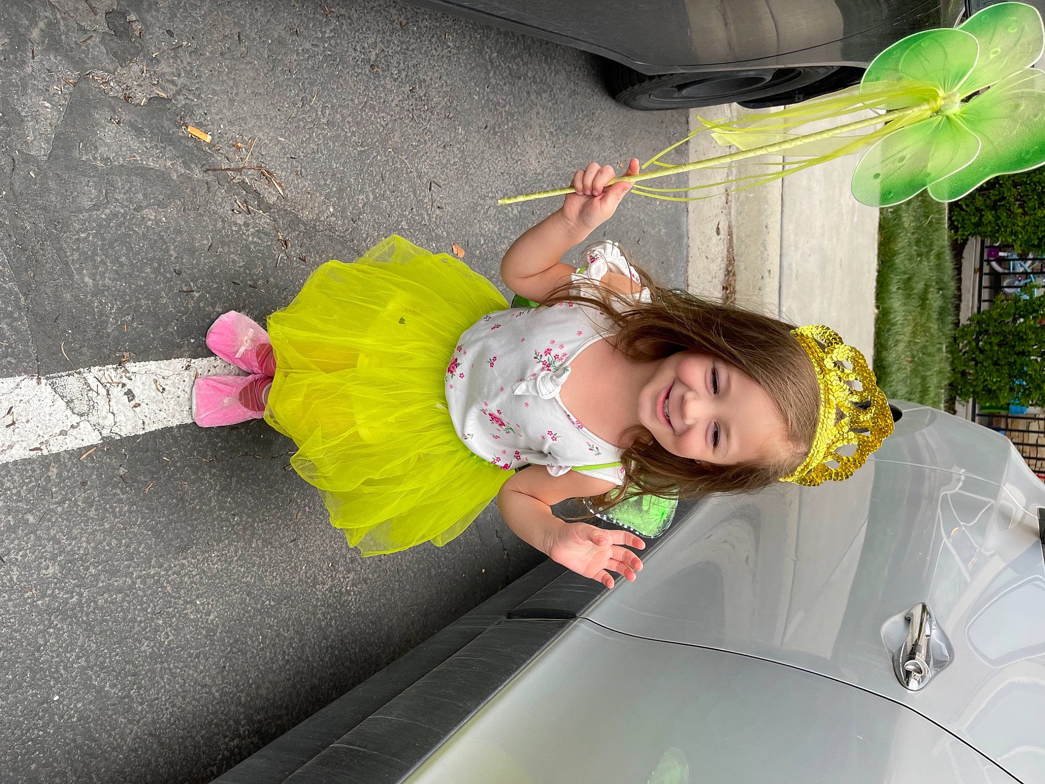 Phoebe joined the competition — help win amazing prizes! asphalt, automotive_exterior, bumper, car, child, dress, event, flower, fun, happy, joy, leisure, luxury_vehicle, motor_vehicle, person, plant, recreation, road_surface, sidewalk, smile