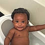 baby, bathtub, bathroom, child, cute, curly_hair, earrings, face, happy, infant, inside, person, portrait, skin, smile, water, wet, young_child, toddler, arm