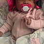 Kai'Loni is registered to the contest to win money with this photo: baby, sleeping, pacifier, blanket, bonnet, pink_clothing, infant, cute, resting, child, indoor, portrait, soft_texture, cartoon_character, hand, cozy, comfort, nap, peaceful, young