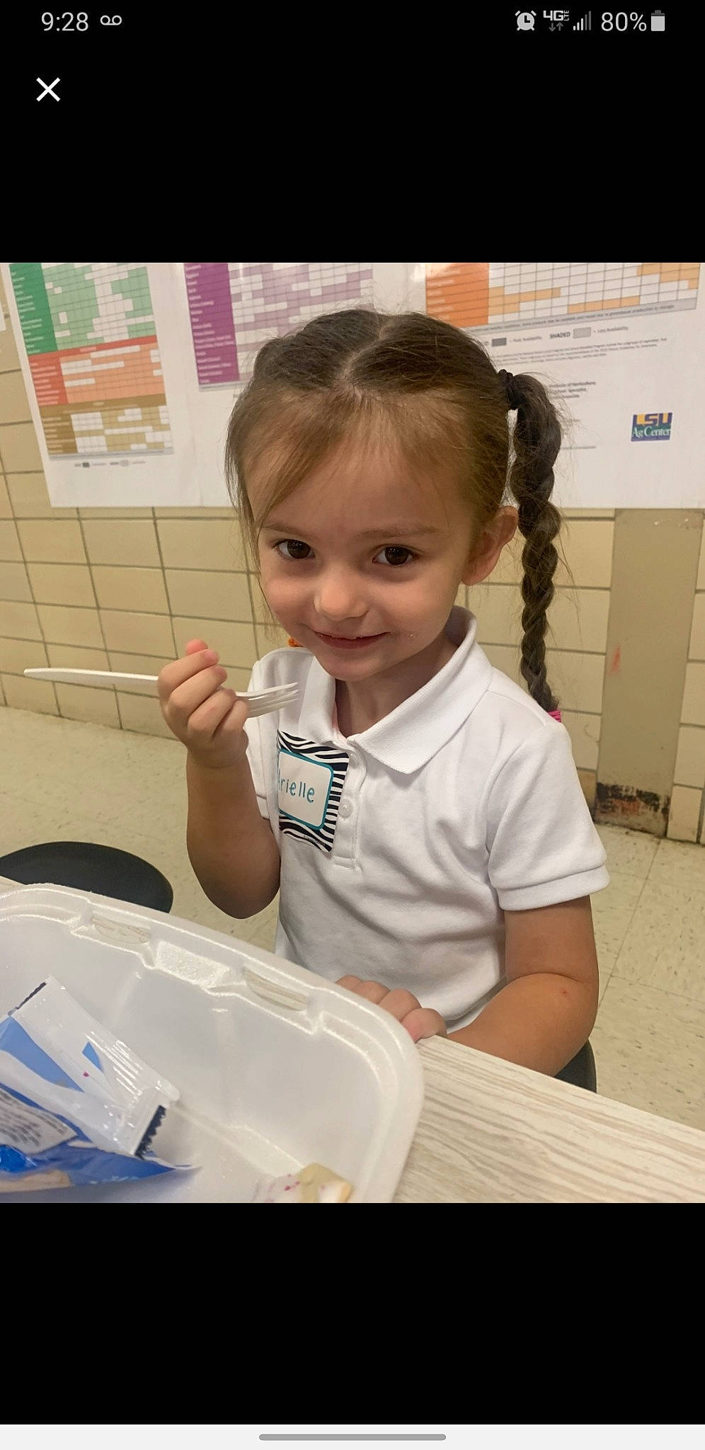 Arielle is registered to the contest to win money with this photo: bathroom, child, comfort_food, cooking, eyelash, flooring, happy, joy, person, plastic, play, plumbing_fixture, room, sitting, smile, t_shirt, table, thumb, toddler, toilet