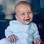 ézio participe au concours pour gagner de l'argent avec cette photo : baby, blue_eyes, car_seat, child, cute, expression, face, hand, happy, indoors, infant, light, portrait, seatbelt, shadow, sitting, skin, smiling, white_pajamas, young