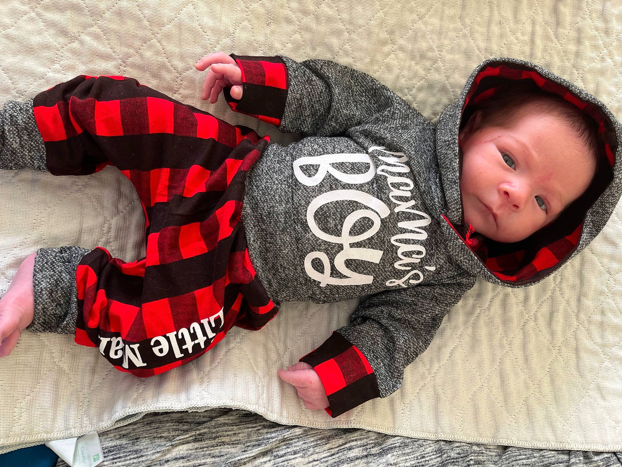 Finnley joined the competition — help win amazing prizes! arm, baby, baby_toddler_clothing, black, cap, comfort, font, hand, headgear, linens, outerwear, pattern, person, personal_protective_equipment, plaid, sleeve, t_shirt, tartan, textile, toddler