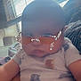 Asher is registered to the contest to win money with this photo: baby, child, glasses, sunglasses, onesie, indoor, person, infant, cute, face, seated, window, blinds, light, hand, clothing, expressionless, digital_filter, portrait, casual