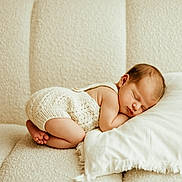 Cora joined the competition — help win amazing prizes! baby, child, couch, cozy, cute, home, indoor, infant, knitted_clothing, newborn, one_person, peaceful, pillow, portrait, relaxation, resting, sleeping, sofa, soft, tender