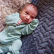 Rene joined the competition — help win amazing prizes! baby, infant, onesie, blanket, soft, texture, lying_down, cute, small, child, sleepwear, cozy, portrait, face, person, newborn, indoors, resting, comfort, warm