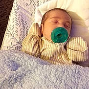 Rene joined the competition — help win amazing prizes! baby, sleeping, pacifier, blanket, pajamas, infant, cozy, closeup, child, face, resting, cute, indoors, bedtime, comfort, soft, peaceful, newborn, person, head