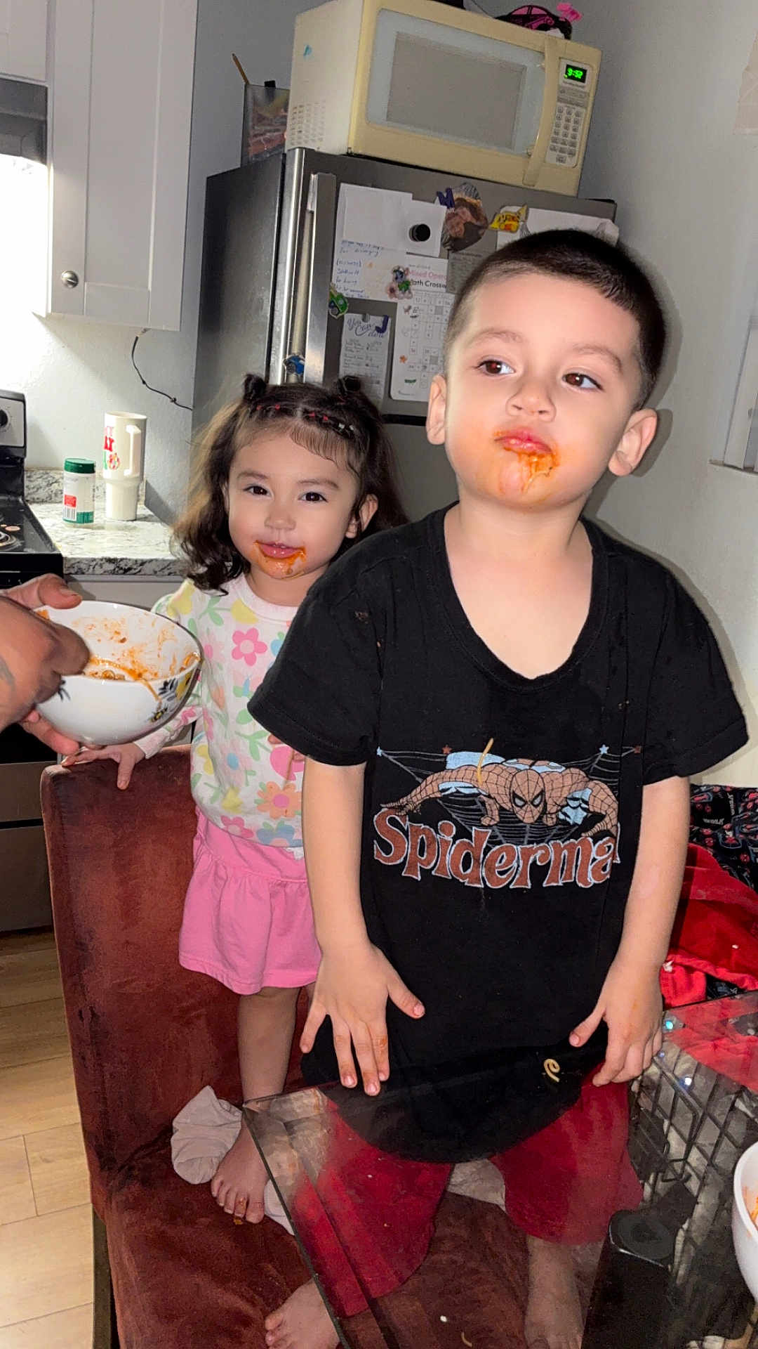 King joined the competition — help win amazing prizes! child, children, boy, girl, kitchen, food, spaghetti, messy, face, smile, shirt, shorts, chair, bowl, hand, refrigerator, microwave, floor, window, home