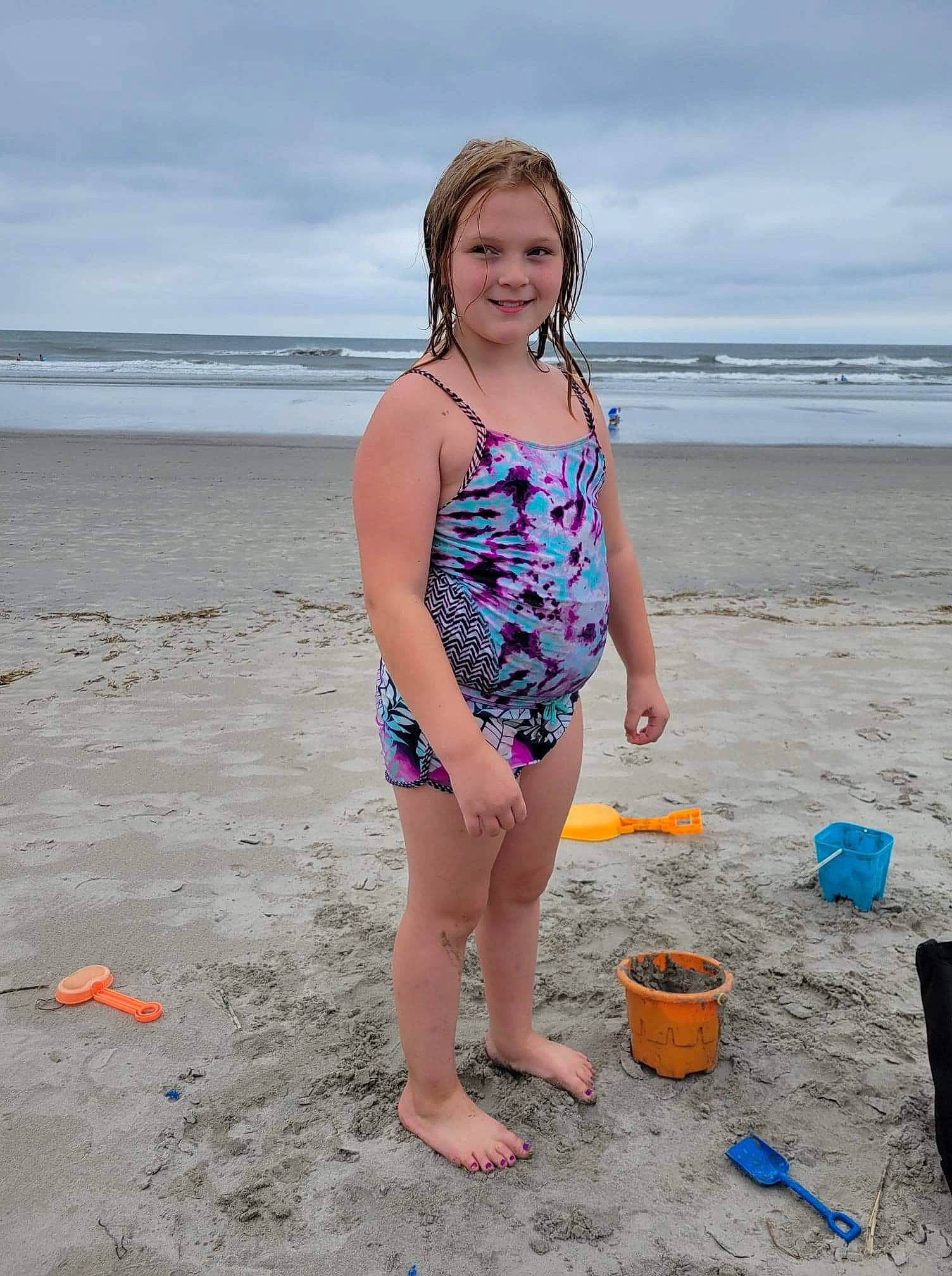 Talulah is registered to the contest to win money with this photo: azure, barefoot, beach, bucket, cloud, electric_blue, fun, happy, holiday, human_leg, joy, leg, leisure, people_on_beach, person, sand, shore, sky, smile, swimwear